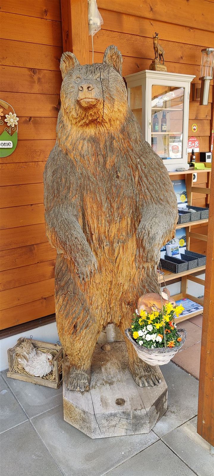 Wooden bear sculpture at the entrance